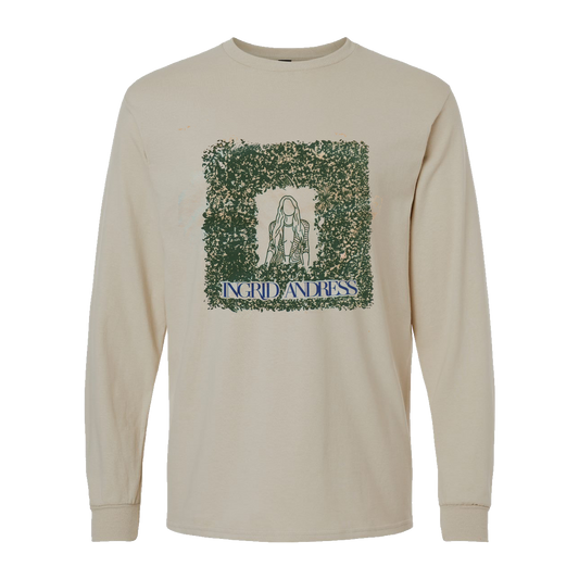 Beige long-sleeve shirt with graphic design and text on a white background